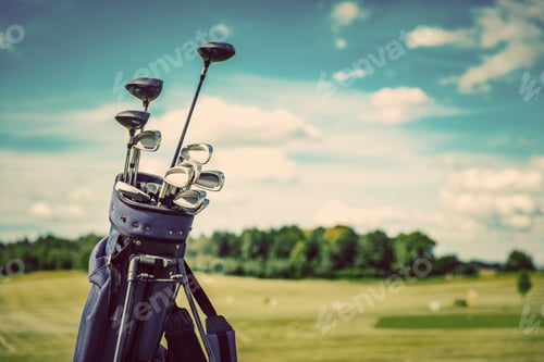 Preview: Golf equipment bag standing on a course.