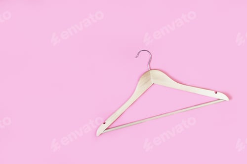 Preview: Wooden hanger on pink background