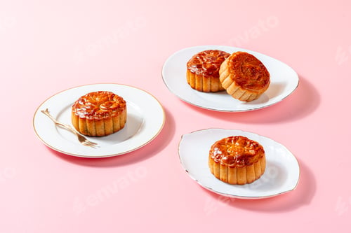 Preview: Three Delicious Mooncakes with Golden Fork on Plates