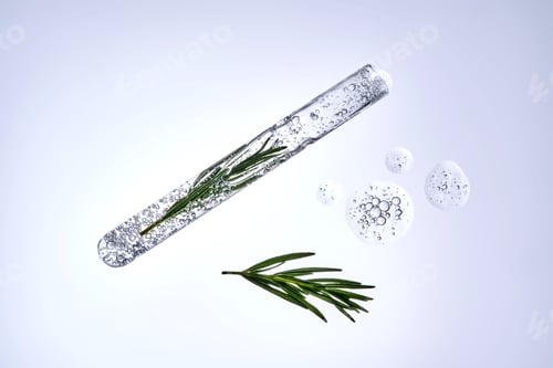 Vista previa: A test tube with rosemary inside and a cosmetic texture.