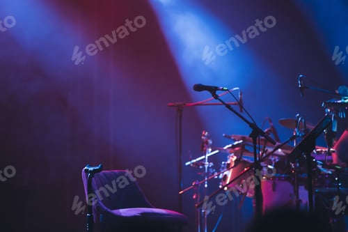 Preview: Colorful stage lights and microphone at concert