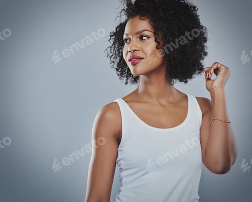 Preview: Stylish Woman in Tank Top Posing in Studio