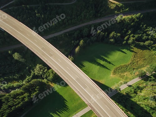Preview: aerial view of empty bridge over beautiful green forest