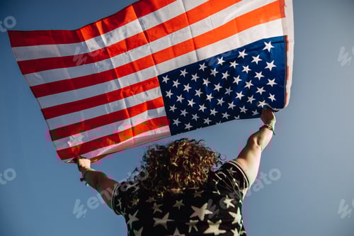 Preview: Girl with an American flag. Independence Day concept