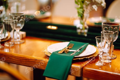 Preview: Banquet table in the restaurant, preparation before the banquet. The work of professional florists.