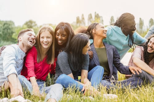 Preview: Group of diverse people having fun outdoor at city park