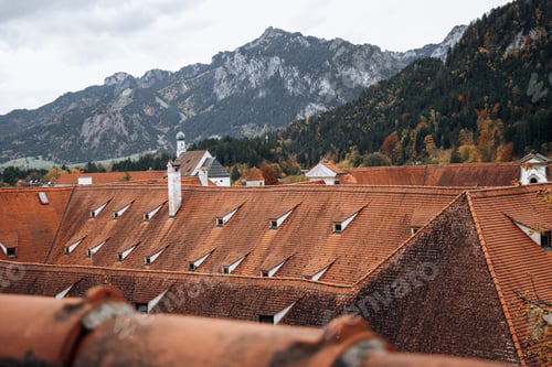 Preview: Mountain views across the red tiled roofs of the houses