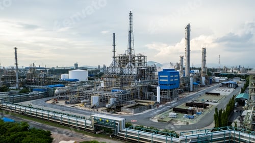 Preview: Aerial view of a big industrial plant with tall towers, storage tanks.
