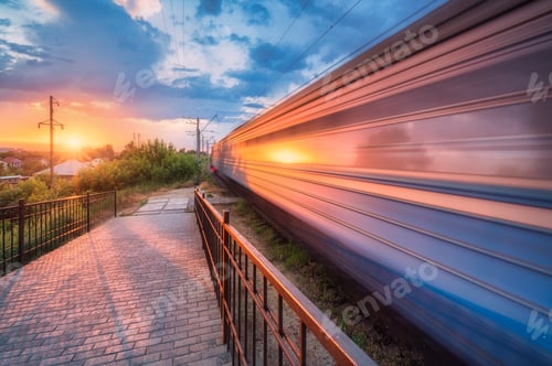 Preview: High speed train in motion on the railway station at sunset