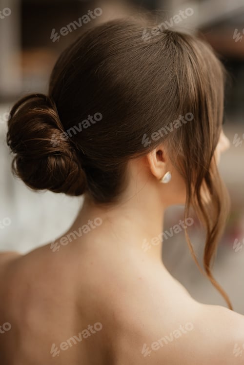 Preview: Elegant Woman's Hairstyle with a Decorative Hair Bun