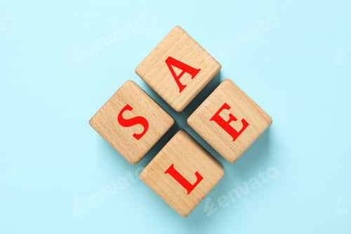 Preview: Wooden cubes with text Sale on blue background