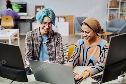 Preview: Software developers using computers in office