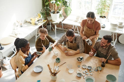 Preview: People Creating Pottery in Studio Top View