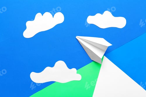 Preview: Paper plane on a blue background with clouds