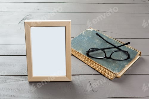 Preview: Blank wooden picture frame on wooden background