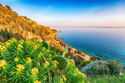Preview: Aquamarine blue waters of sea near Taormina resorts and Etna volcano mount