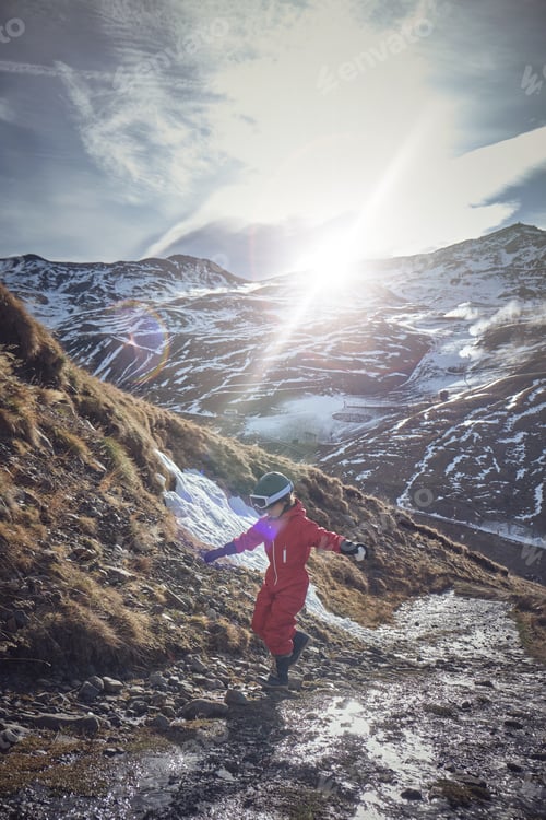 Preview: Kid balancing on stones in mountains