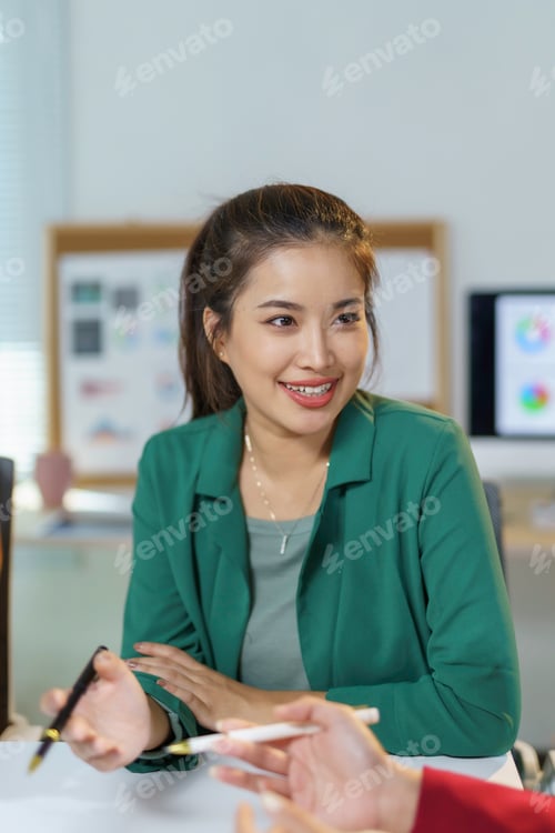 Preview: Smiling Woman Discussing Business in Modern Office