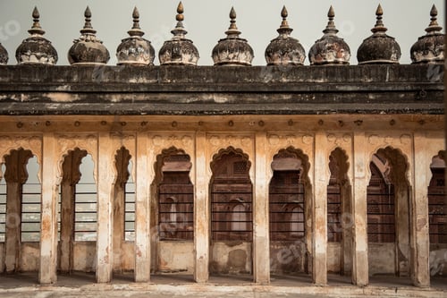 Preview: Ancient arches and domes adorning rooftop of historic building in Udaipur, India