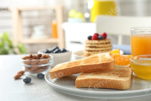 Preview: Delicious breakfast with toasted bread served on light table indoors