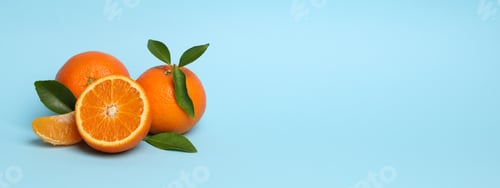 Preview: Ripe sweet mandarins on blue background, space for text