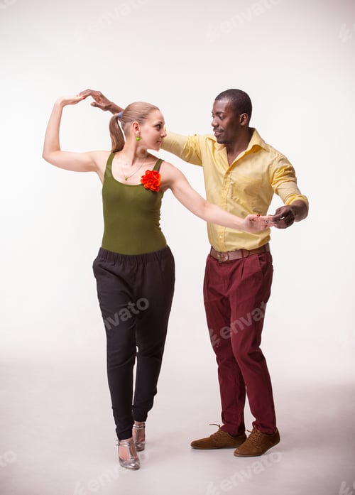 Preview: Young Couple Dances Social Caribbean Salsa, Studio Shot On White Background. Positive Human