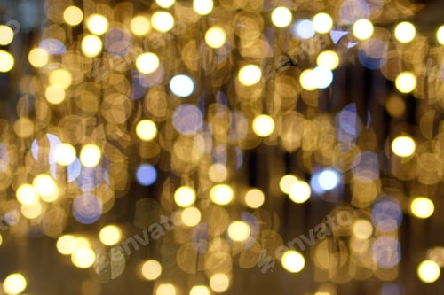 Preview: Blurred background in golden colors for New Year and Christmas theme with copy space.