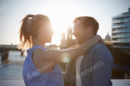 Preview: Romantic Couple Standing On Bridge Over River Thames In London