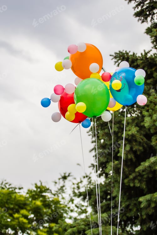 Preview: Multicolored balloons against the background of a cloudy sky