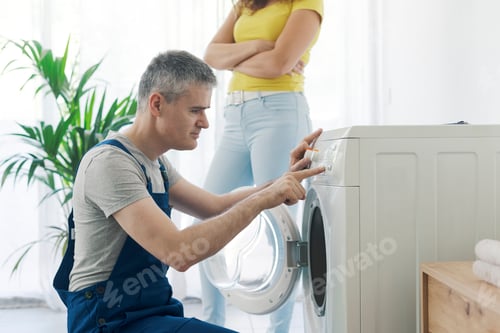 Preview: Professional plumber checking a washing machine