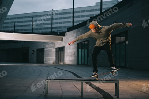 Preview: professional skateboarder balancing with board on bench