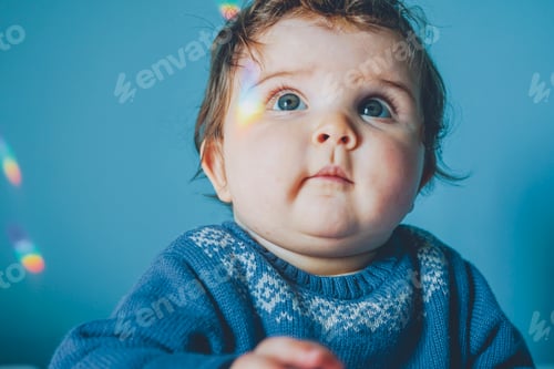 Preview: Little baby surrounded by rainbow lights