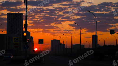 Preview: Urban landscape with highway on background of red sunset sky. Concept. Dark silhouettes of city