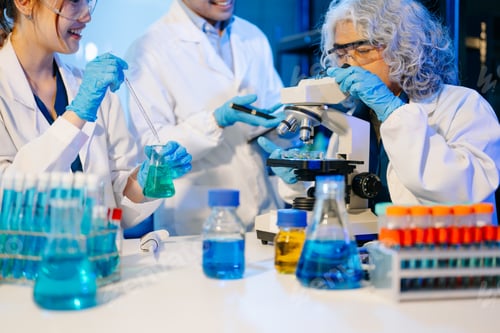Preview: Scientist team meeting and writing analysis results in the laboratory study
