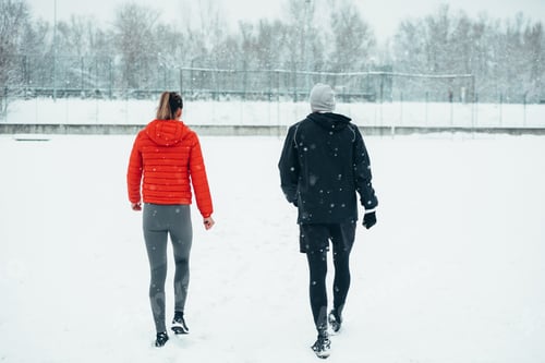 Preview: Young couple going for a run together during a snow