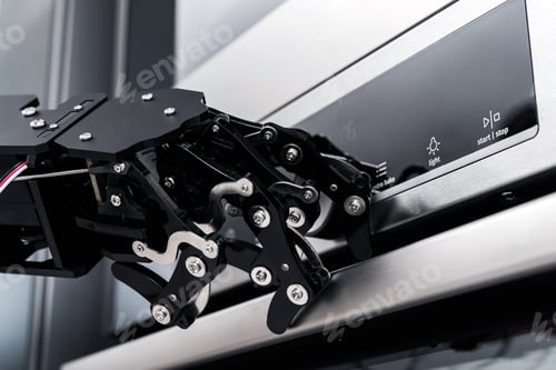 Preview: Real robot's hand and electric oven. Concept of robotic process automation