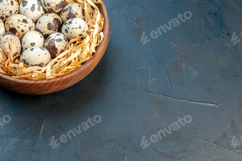 Preview: Half shot of fresh poultry chicken farm eggs in a tissue basket in a brown bowl on the right side on