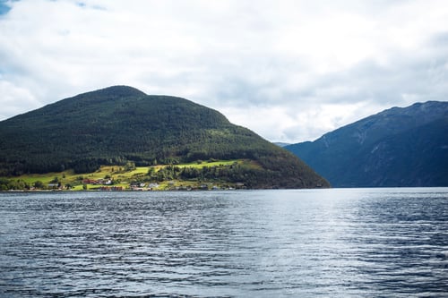 Preview: Picturesque Norway mountain village landscape. Amazing nature view with fjord and mountains.