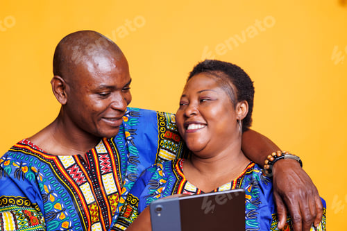 Preview: Black couple enjoying digital tablet