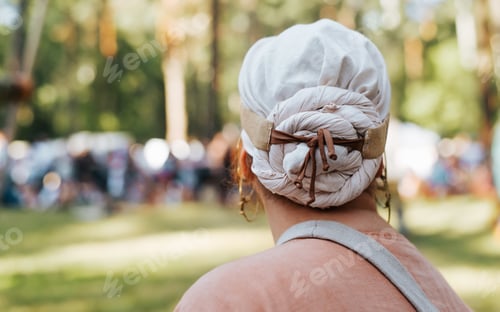 Preview: Female medieval folk scarf on woman's head. Close-up, back view, copy space