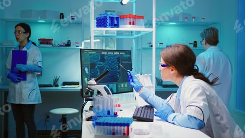 Preview: Woman biochemist checking manifestations of virus