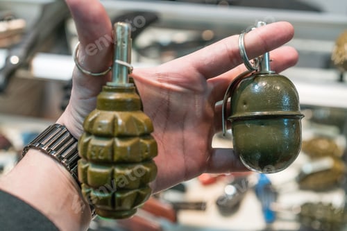 Preview: Hand holding grenades