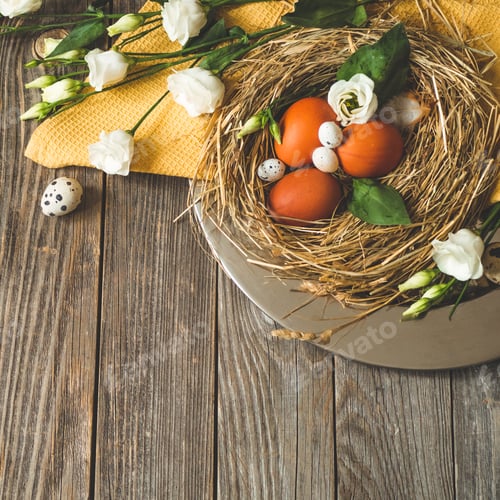 Preview: Easter eggs in a nest on a metal plate on a wooden background.