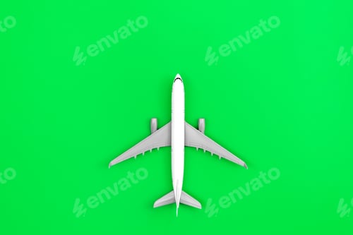 Preview: White plane, airplane on a green background, flat lay.
