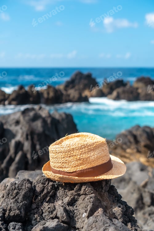 Preview: Hat next to a natural pool in summer, coastal town of Porto Moniz, Madeira. Vertical, lifestyle