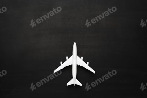 Preview: Miniature airplane on black background