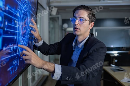 Preview: Man Operating Futuristic Data Interface on Touchscreen