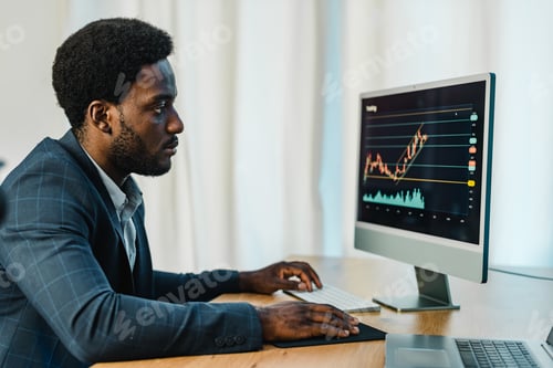 Preview: Professional Man Analyzing Data at His Desk