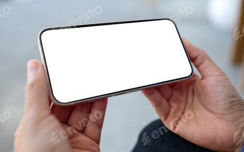 Preview: Mockup image of a woman holding and using mobile phone in the outdoors