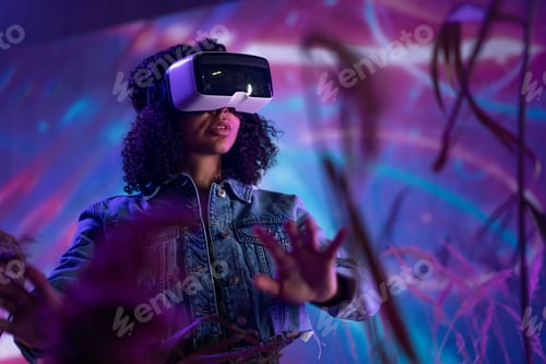 Preview: Metaverse digital cyber world technology, woman with virtual reality VR goggles playing augmented